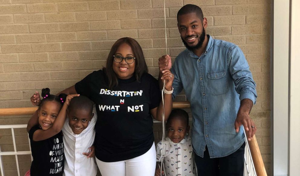 PHOTO: Candace Hall was surprised by her three children after defending her dissertation thesis for a doctorate in education.