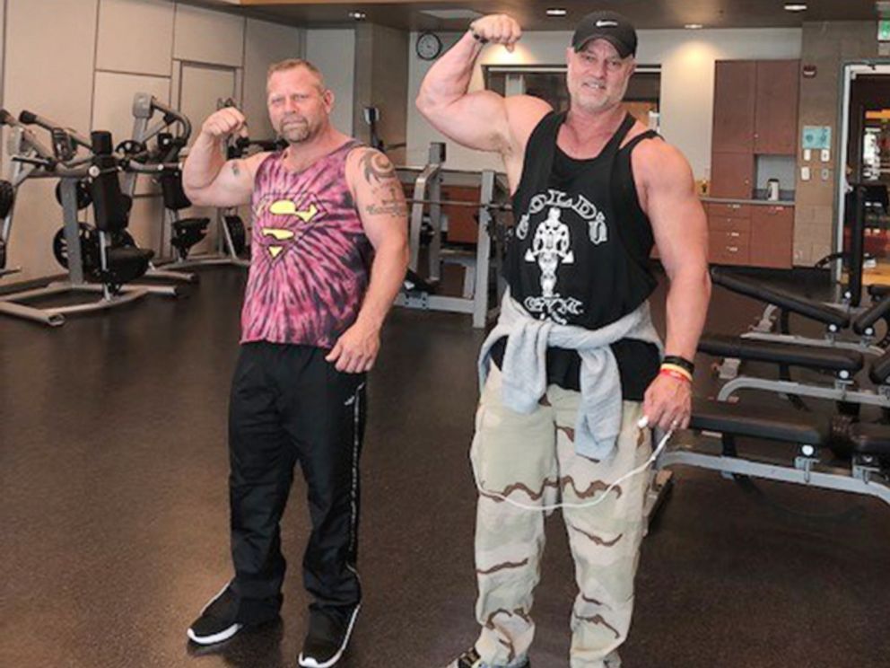 PHOTO: Jason White, left, poses for a photo with his half-brother, Dan Green, in Las Vegas, after the two met in 2017 after taking at-home DNA tests.