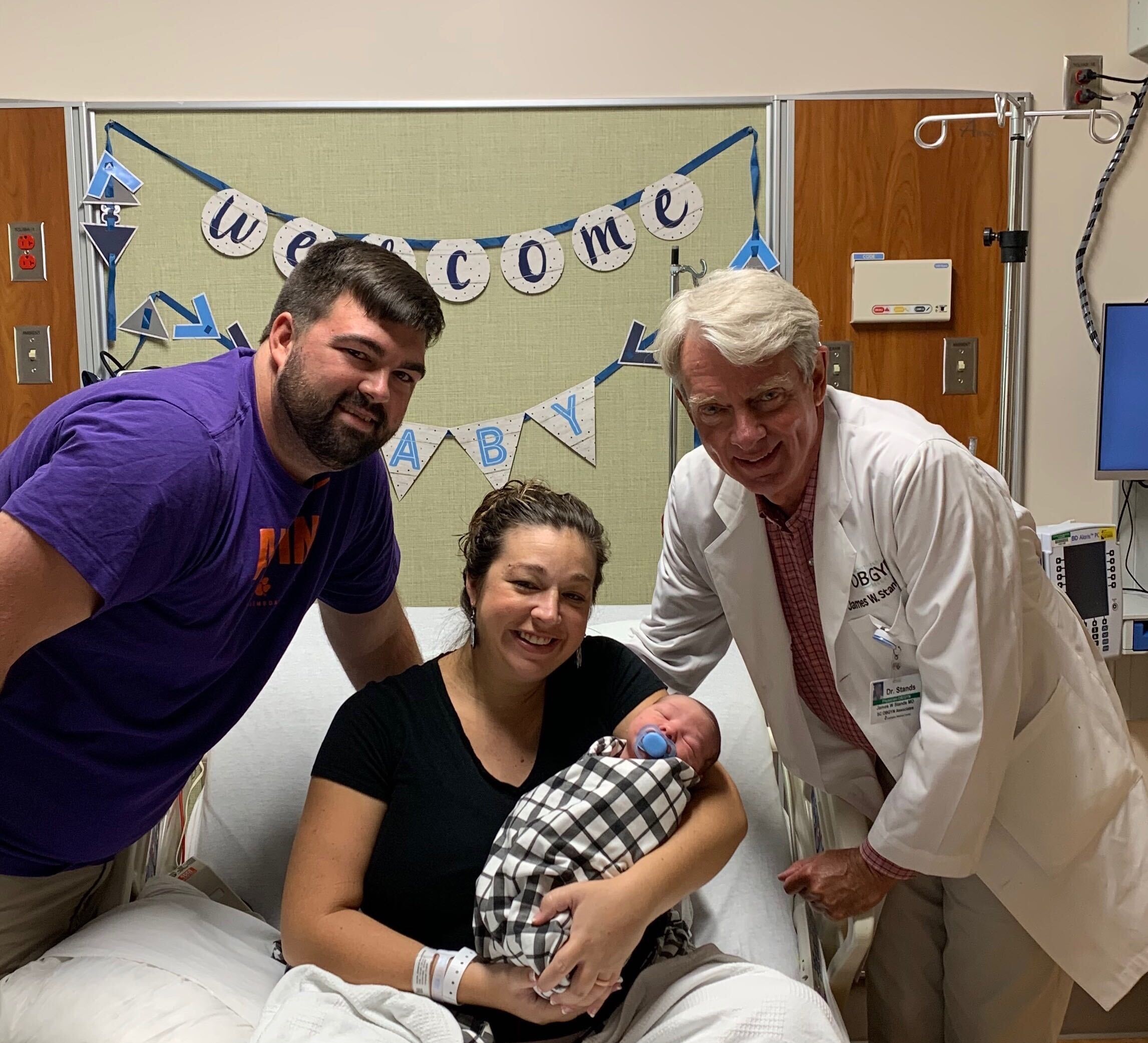 PHOTO: Max and Jenna Hazen pose with Dr. James Stands, of Lexington Medical Center in South Carolina. Stands delivered Jenna Hazen on Jan. 14, 1991, then Max Hazen on Aug. 9 that same year. On Sept. 2, 2020 Stands delivered he couple's newborn son.