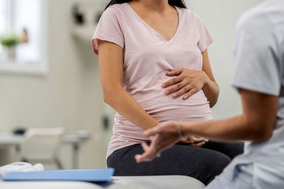 PHOTO: Stock photo of a pregnant woman speaking with her doctor.