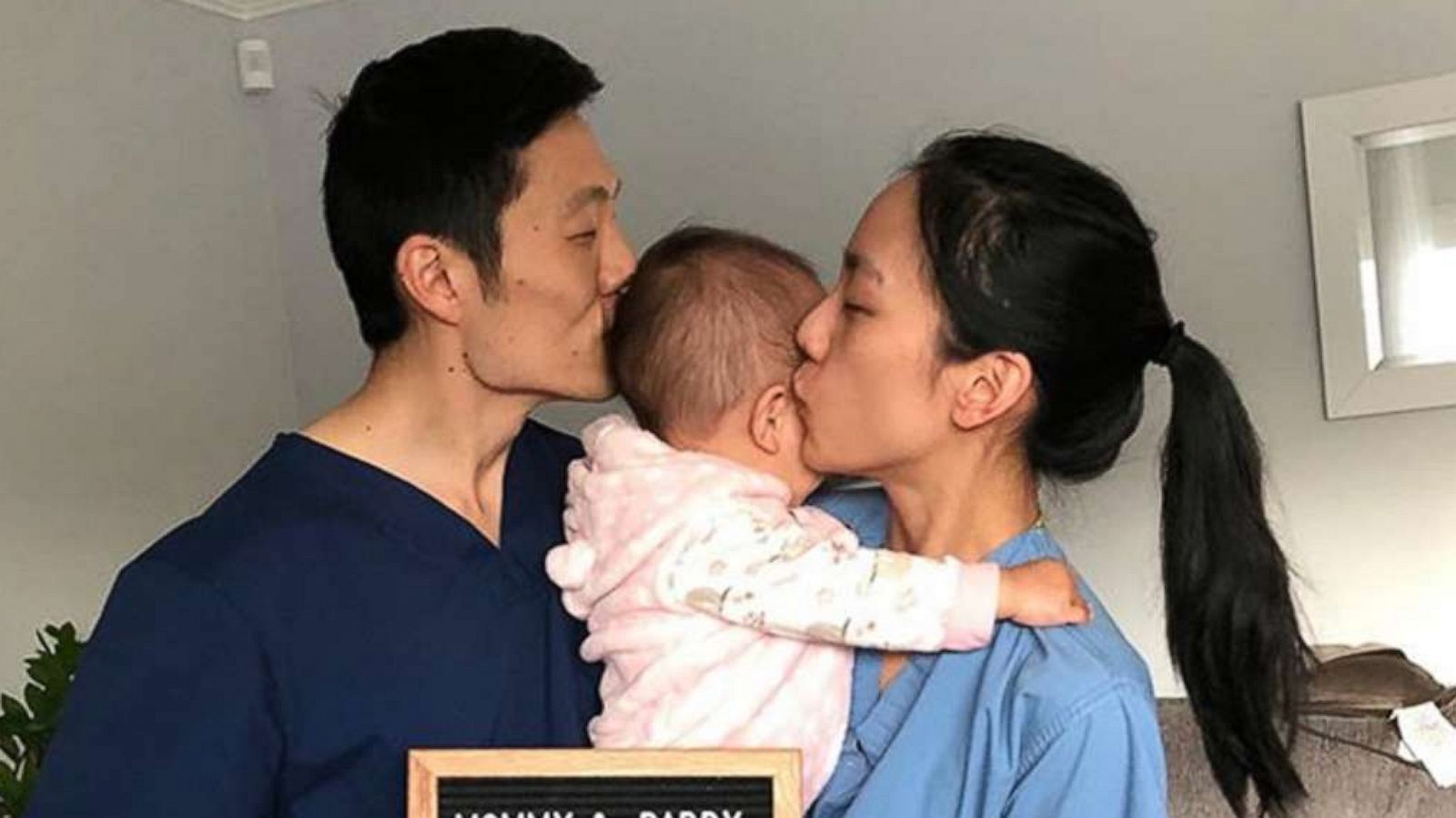 PHOTO: Doctors Peggy and James Ji kiss their daughter, 1, in a photo shared to Peggy Ji's Instagram account on April 3, 2020.