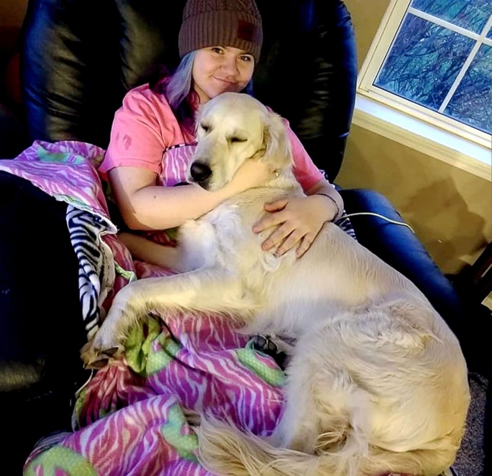 PHOTO: Quinn, a Golden Retriever was captured on film as her family member Jenny D'Agostino of Illinois, perfected her yoga poses.