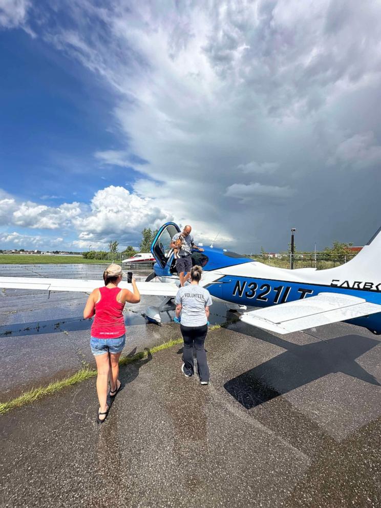 PHOTO: Dr. Brian Rambarran from Buffalo, New York flies his plane to save dogs from kill shelter and bring them to Nickel City Canine Rescue in Williamsville, New York.