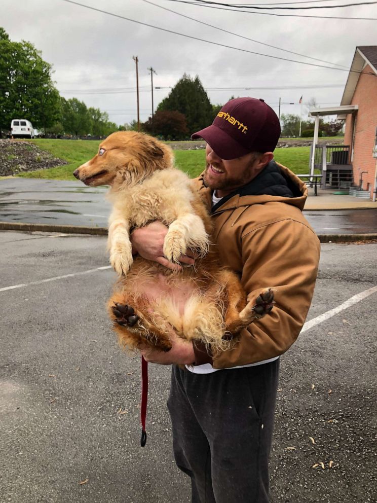 PHOTO: Eric Johnson, 37, reunited with miniature Australian Shepherd, Bella, who was lost during the category 4 tornado that hit Cookeville, Tenn. on May 3, 2020.