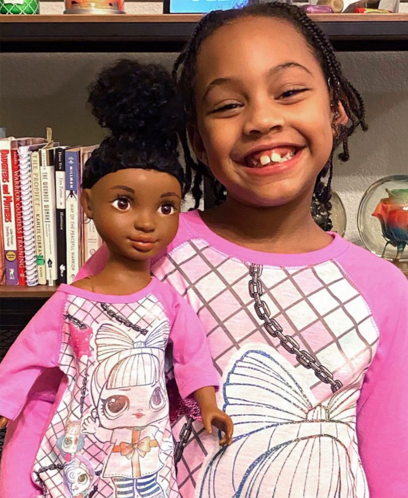 PHOTO: Sariah Prather, 7, of Cedar Park, Texas, smiles alongside her curlfriend, "Zoe," from the Healthy Roots Dolls company.