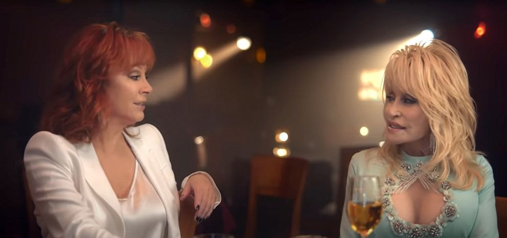 PHOTO: Reba McEntire and Dolly Parton sing in an image taken from the official music video of their new song "Does He Love You," released via YouTube.