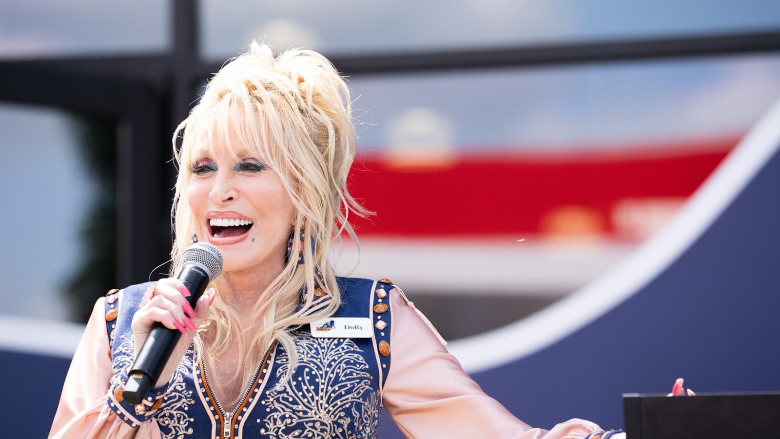 PHOTO: Dolly Parton speaks to the crowd during the grand opening of Dolly's Tennessean Travel Stop in Cornersville, Tennessee, June 24, 2026.