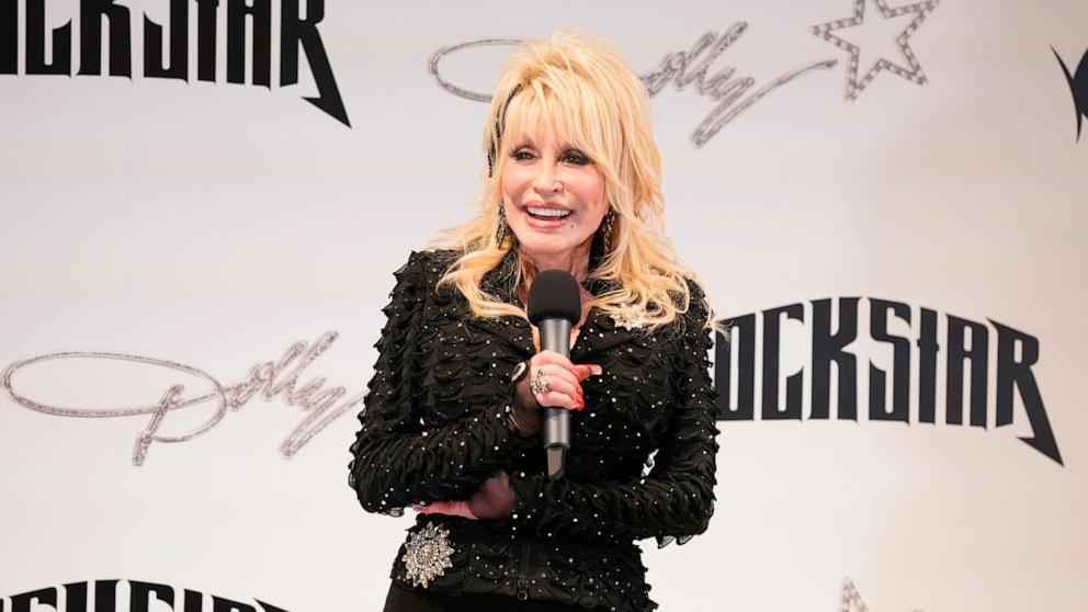 PHOTO: Dolly Parton attends the Dolly! All Access Pop-Up Store Preview & Press Conference at The Star in Frisco on May 9, 2023 in Frisco, Texas.