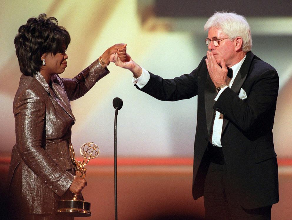 PHOTO: Phil Donahue blows a kiss to Oprah Winfrey as she presents him with a Lifetime Achievement Award at the 23rd Annual Daytime Emmy Awards in New York Wednesday, May 22, 1996.