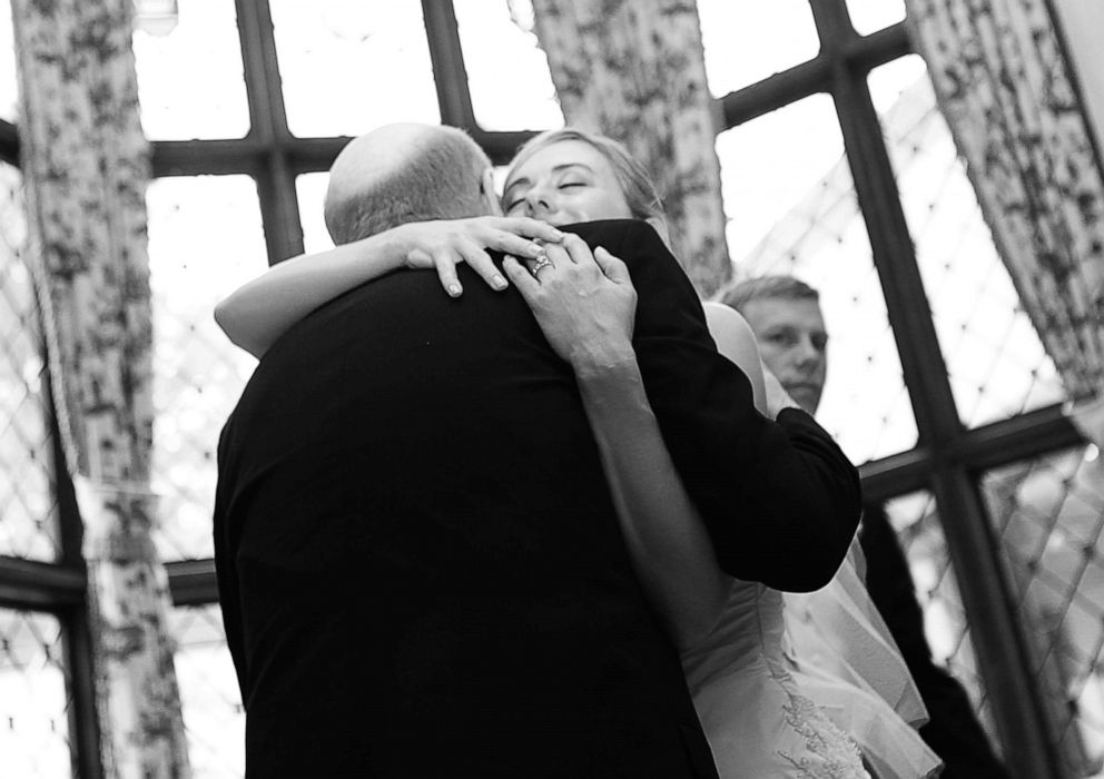 PHOTO: Donald Adair hugs his daughter Abby Adair Reinhard on her wedding day.