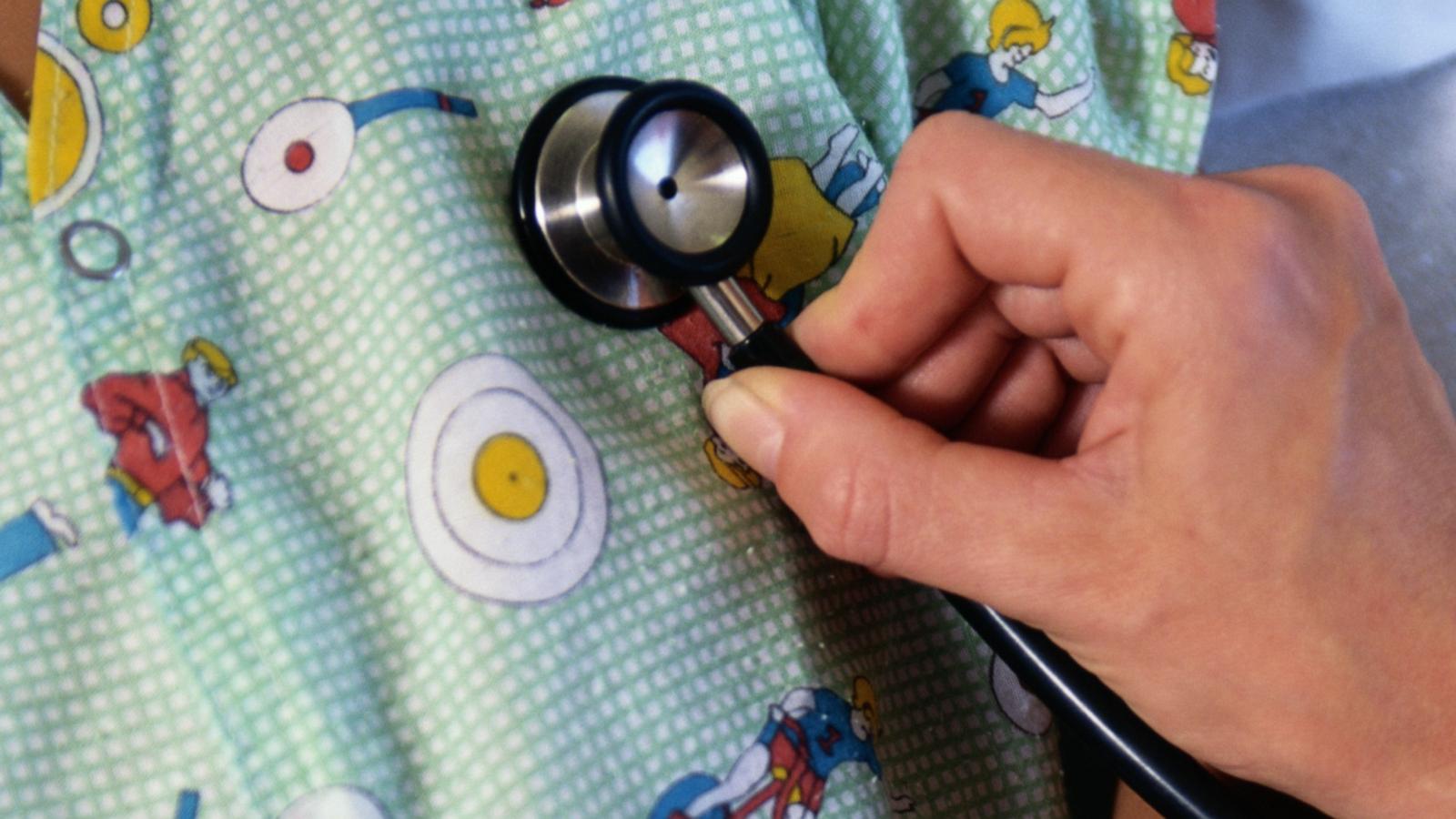 PHOTO: In this undated stock photo a Dr. listens with stethoscope.