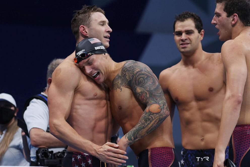 PHOTO: Caeleb Dressel of Team United States celebrates with teammates after winning the gold medal and setting a new world record in Men's 4 x 100m Medley Relay Final on day nine of the Tokyo 2020 Olympic Games on August 1, 2021 in Tokyo, Japan.