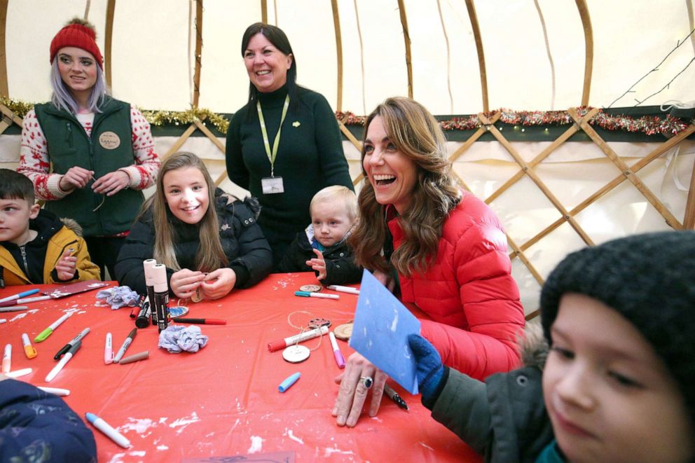 PHOTO: Britain's Catherine, Duchess of Cambridge reacts in the 'Elf workshop' during a visit to Peterley Manor Farm where she took part in activities with families who are supported by the Family Action charity, in Buckinghamshire, England, Dec. 4, 2019.