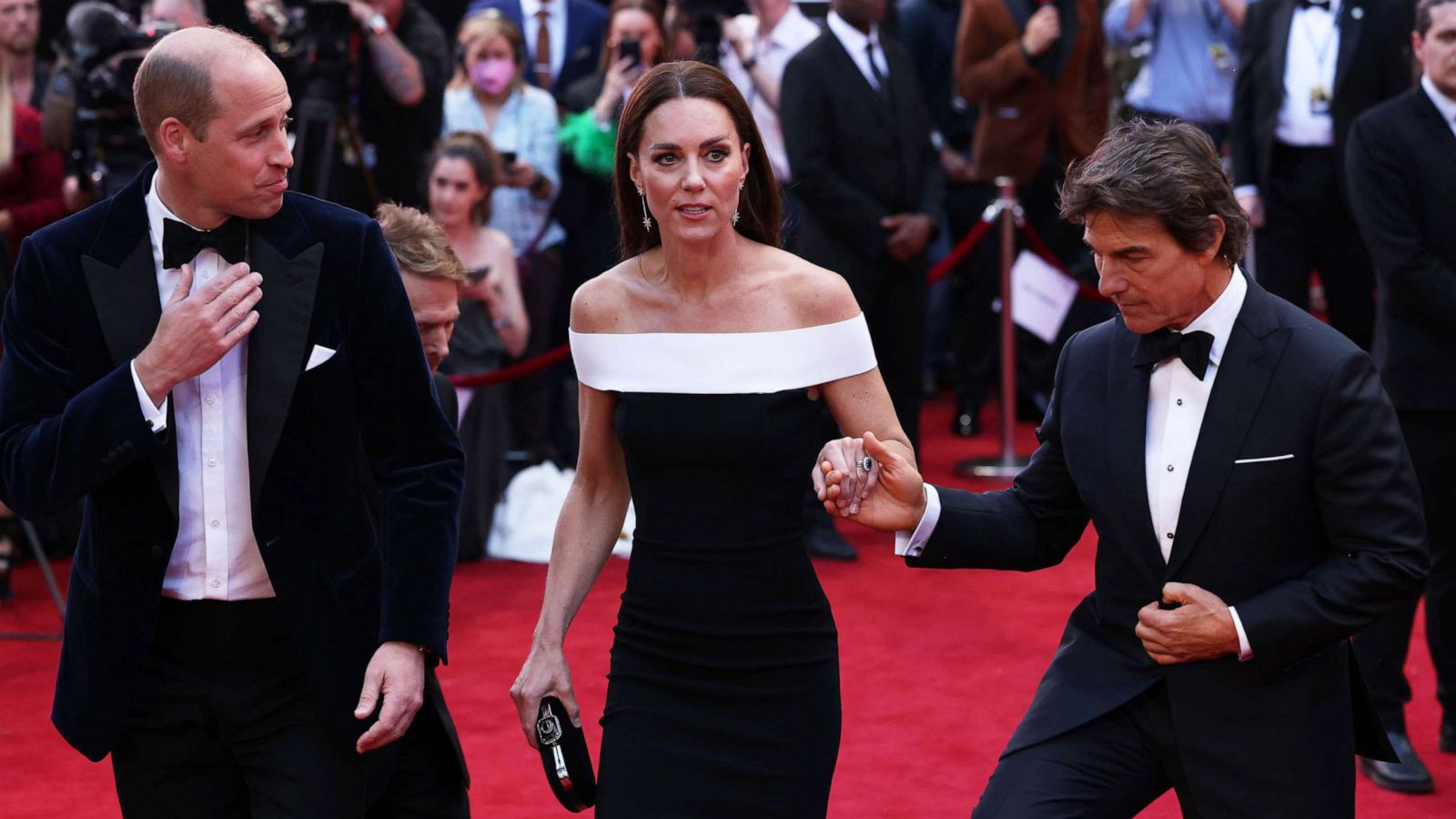 PHOTO: Prince William, Duke of Cambridge and Catherine, Duchess of Cambridge are accompanied by star actor Tom Cruise as they arrive for the "Top Gun: Maverick" Royal Film Performance at Leicester Square on May 19, 2022, in London.