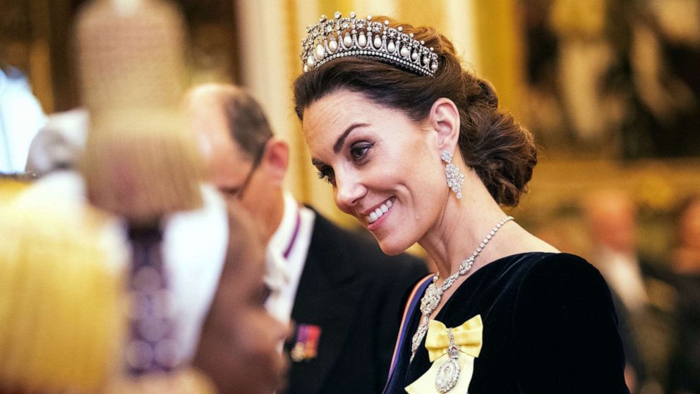 PHOTO: Catherine, Duchess of Cambridge talks to guests at an evening reception for members of the Diplomatic Corps at Buckingham Palace in London, Dec. 11, 2019.