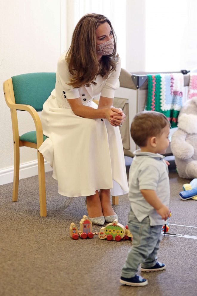 PHOTO: Catherine, Duchess of Cambridge, wearing a face mask, talks to a family supported by Baby Basics during a visit to Baby Basic UK & Baby Basics Sheffield, Aug. 4, 2020, in Sheffield, England.
