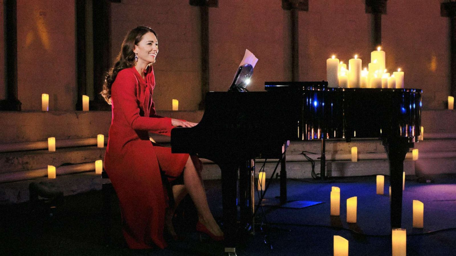 PHOTO: Catherine Duchess of Cambridge accompanies singer Tom Walker on the piano, during a performance of his song "For Those Who Can't Be Here" during Royal Carols: Together At Christmas.