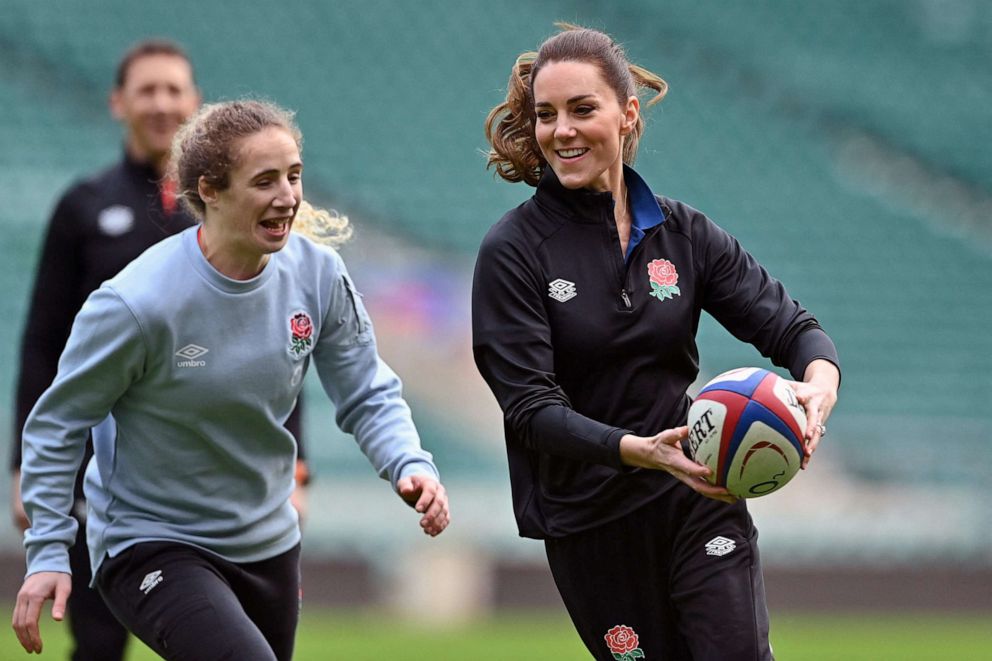 PHOTO: Britain's Catherine, Duchess of Cambridge runs with the ball as she takes part in the England's rugby teams training sessions at the Twickenham Stadium, in London, on Feb. 2, 2022, as part of her new role as Patron of the Rugby Football Union.