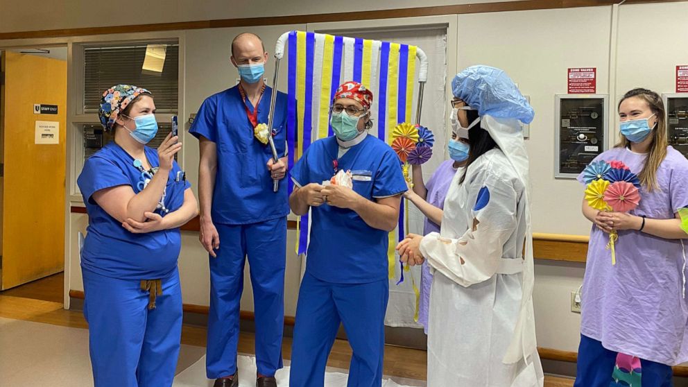 PHOTO: Duke Health providers and trainees prepare for the Zoom nuptials of Duke Ob/Gyn resident Dr. Shelun Tsai and fiance Dr. Michael Sun, a resident in Duke Psychiatry's program, in Durham, N.C., April 11, 2020.