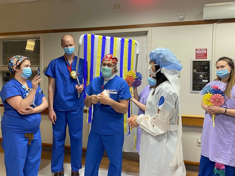 PHOTO: Duke Health providers and trainees prepare for the Zoom nuptials of Duke Ob/Gyn resident Dr. Shelun Tsai and fiance Dr. Michael Sun, a resident in Duke Psychiatry's program, in Durham, N.C., April 11, 2020.