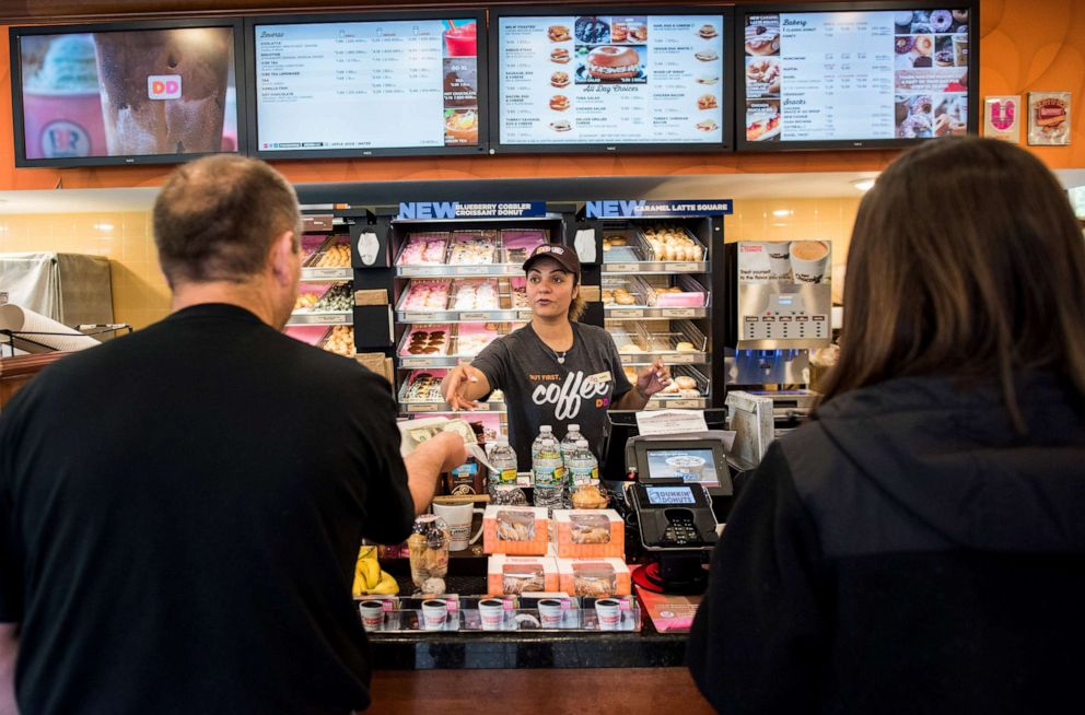 PHOTO: An employee helps customers at a Dunkin' Donuts Inc. location in Ramsey, New Jersey, U.S., on Thursday, May 5, 2016.