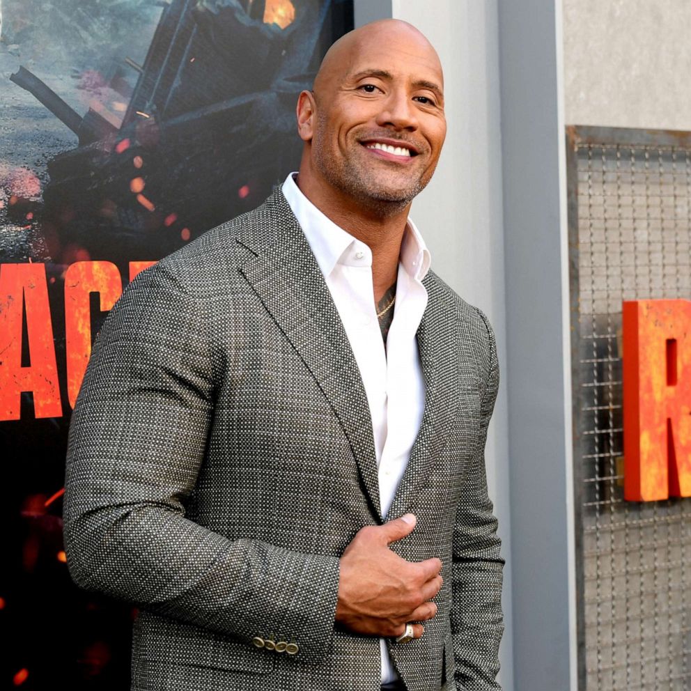 In this April 4, 2018, file photo, Dwayne Johnson arrives at the premiere o...