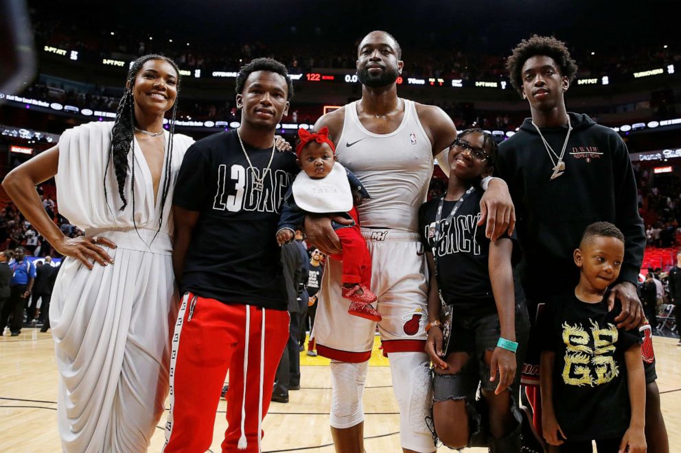PHOTO: Dwyane Wade poses with his wife, Gabrielle Union, nephew, Dahveon Morris, and children, Kaavia James Union Wade, Zaire Wade, Xavier Wade and  Zion Wade after his final career home game at American Airlines Arena, April 9, 2019, in Miami.