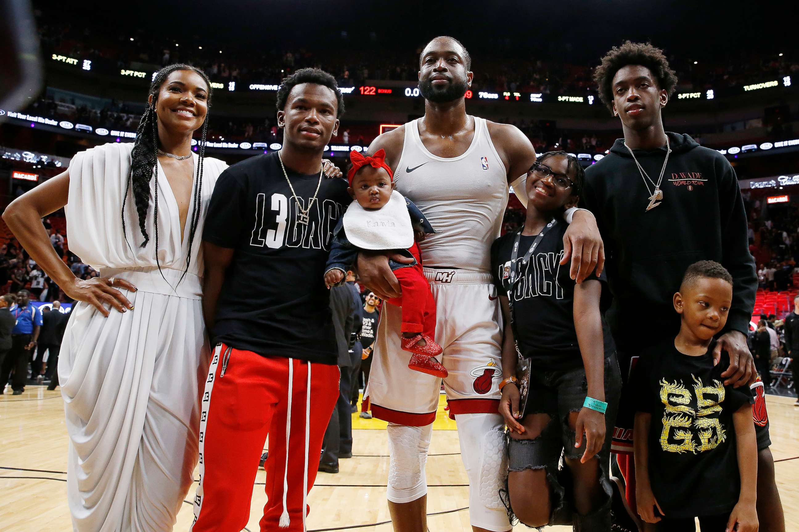PHOTO: Dwyane Wade #3 of the Miami Heat poses with wife, Gabrielle Union, nephew, Dahveon Morris, and children, Kaavia James Union Wade, Zaire Wade, Xavier Wade and Zaya Wade after his final career home game on April 09, 2019, in Miami.