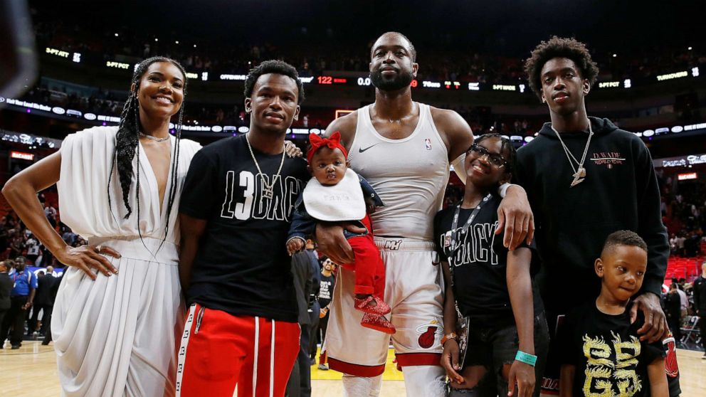 PHOTO: Dwyane Wade #3 of the Miami Heat poses with wife, Gabrielle Union, nephew, Dahveon Morris, and children, Kaavia James Union Wade, Zaire Wade, Xavier Wade and Zaya Wade after his final career home game on April 09, 2019, in Miami.