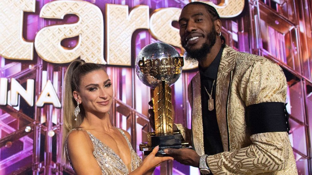 PHOTO: Daniella Karagach and Iman Shumpert hold the Mirrorball Trophy on "Dancing with the Stars," Nov. 22, 2021.