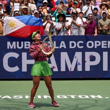 PHOTO: Alexandra Eala holds the Championship Trophy after winning the women's singles championship match against Jessica Pegula at the Mubadala DC Open 2026 at William H.G. FitzGerald Tennis Center on August 3, 2026 in Washington, DC.