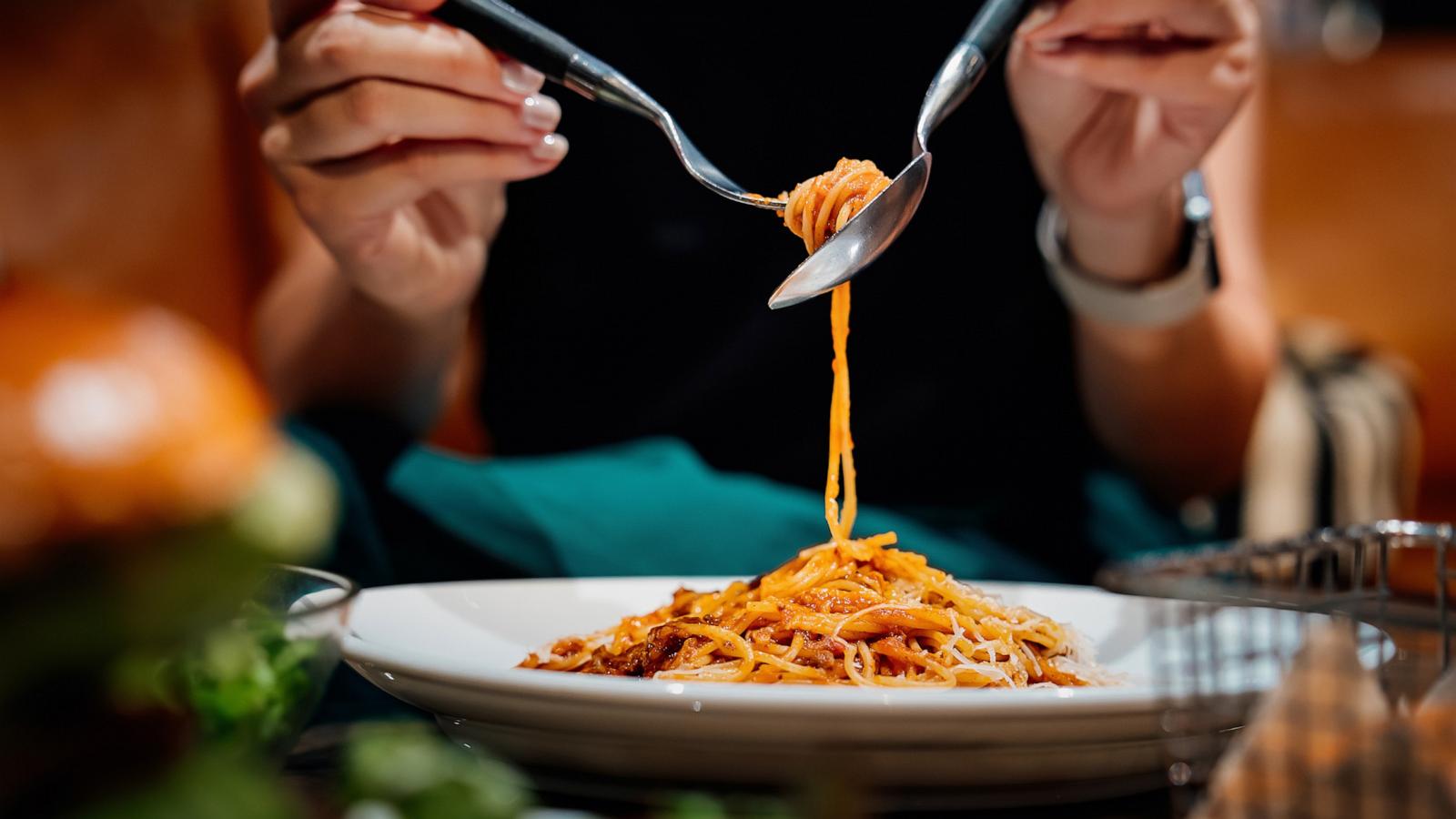 PHOTO: Stock photo of a person eating dinner.