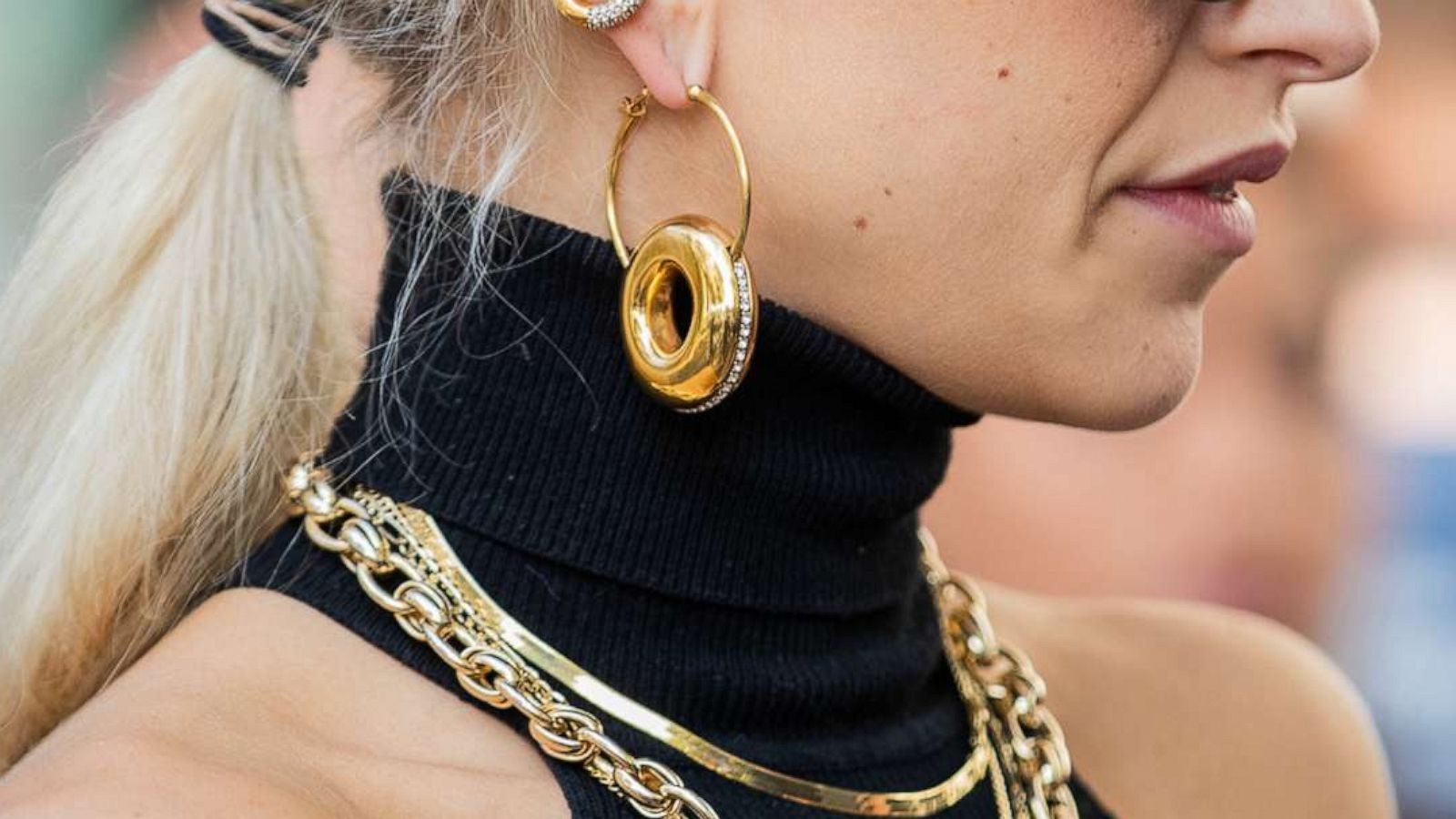 PHOTO: A woman is seen wearing jewelry: golden earrings, necklace and ring, during Paris Fashion Week, Sept. 30, 2019 in Paris.