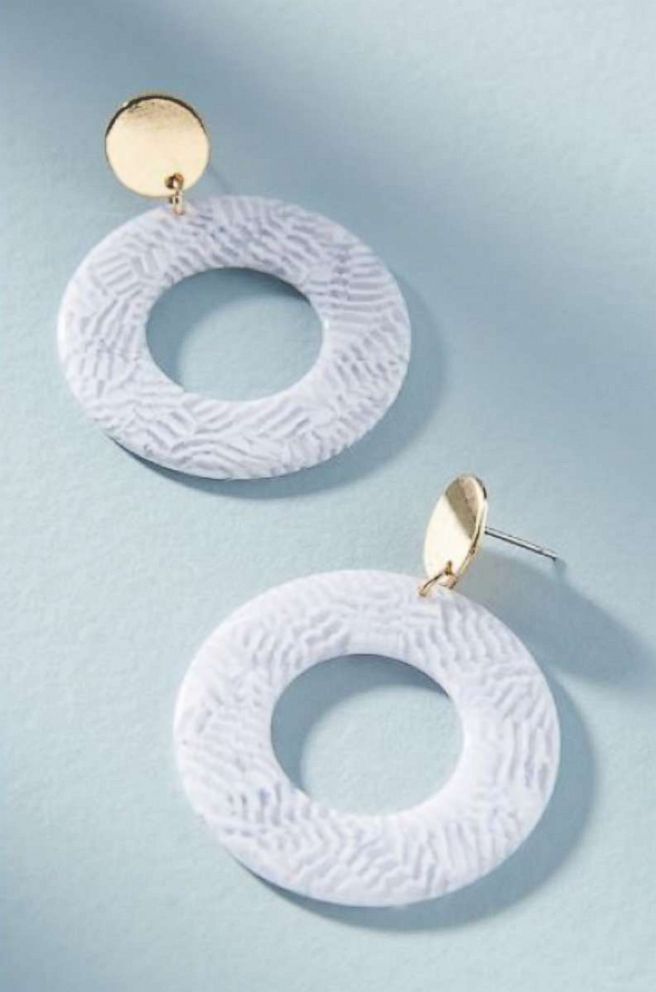 PHOTO: Go for resin hoops. This summer they’ve been spotted on celebs like Bella
Hadid, who travels often and knows the last thing you want to worry about on vacation is complicated jewelry. Lele Sadoughi, Marble Renis Hooped Drop Earrings, $58.