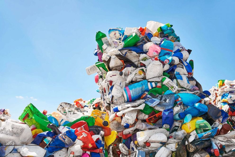 PHOTO: Mountains of plastic rubbish stand outdoors at recycling factory in an undated stock image.
