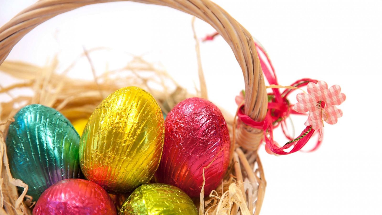 PHOTO: An Easter basket is filled with multi colored chocolate candy eggs.