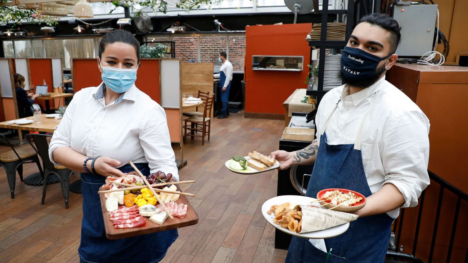 PHOTO: Staffers work the opening of a restaurant on the Eataly Flatiron Rooftop on April 15, 2021, in New York.