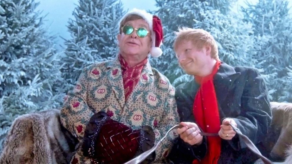 PHOTO: Elton John and Ed Sheeran perfom their song "Merry Christmas" in an image taken from their official music video.