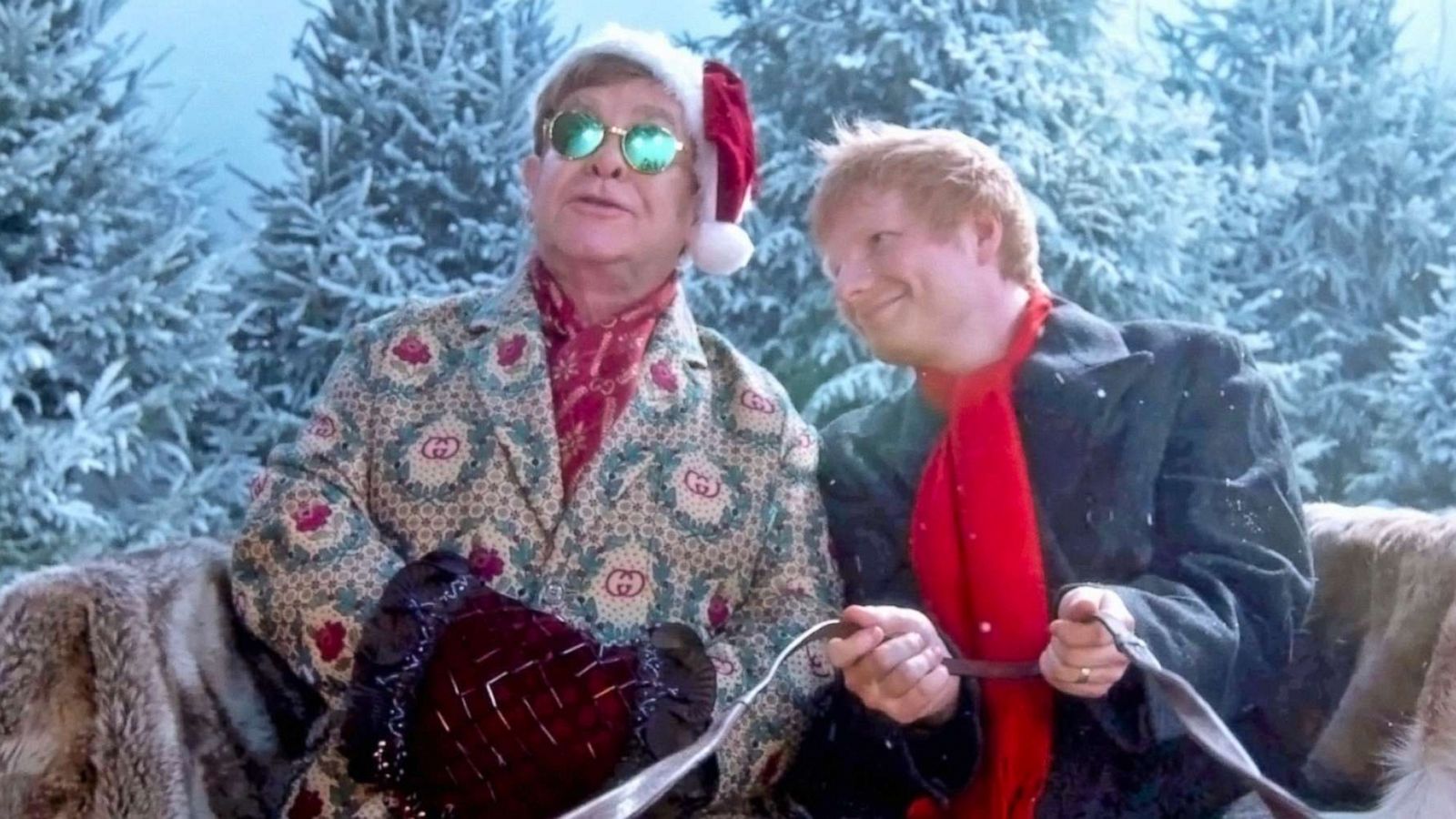 PHOTO: Elton John and Ed Sheeran perfom their song "Merry Christmas" in an image taken from their official music video.