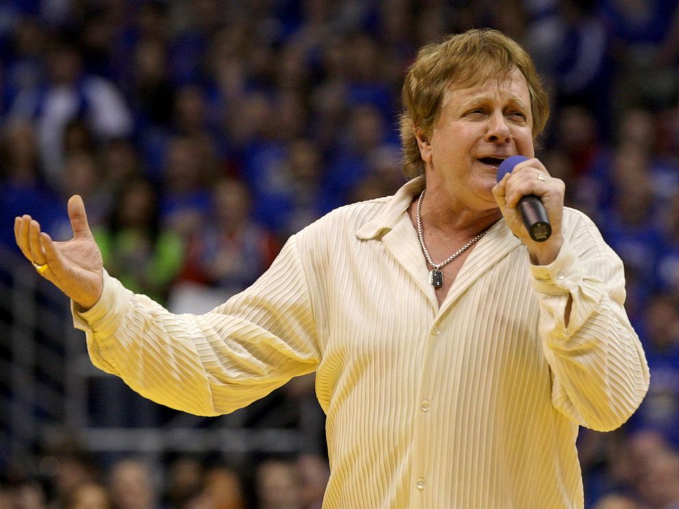 PHOTO: Eddie Money sings the national anthem before an NCAA college basketball game between Kansas and Missouri in Lawrence, Kan., Jan. 25, 2010.