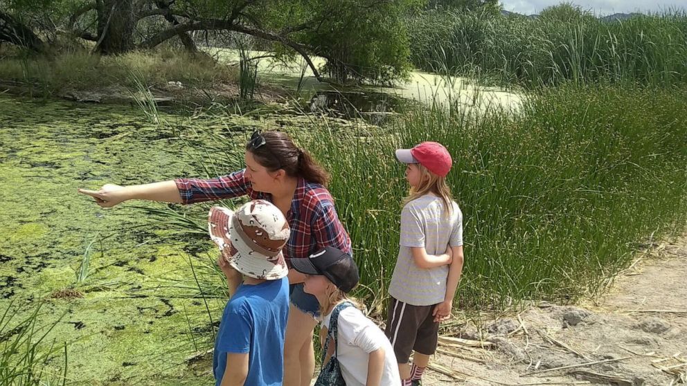 PHOTO: In a photo dated May 2020, Heather Mace, an educator from Tucson, Arizona, is seen with her three children during a trip to the Sweetwater Wetlands in Tuscon.