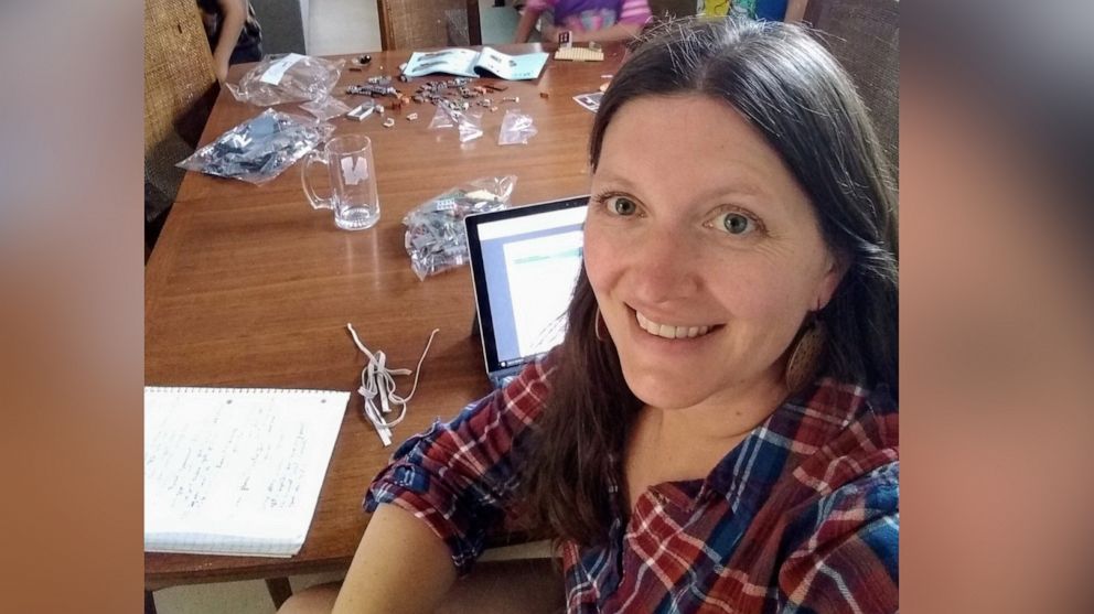 PHOTO: Heather Mace, an educator from Tucson, Arizona, poses in front of her laptop as she works from home amid the novel coronavirus pandemic.