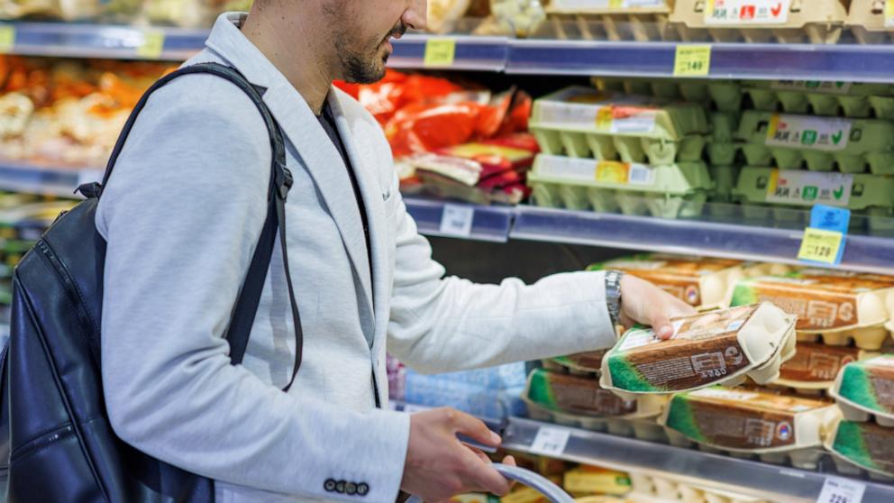 PHOTO: In this undated stock photo, a customer examines eggs in the egg aisle of the supermarket.