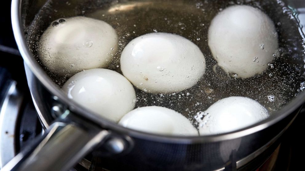 PHOTO: A closeup of white eggs boiling in pot of hot water in this stock photo.
