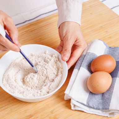 PHOTO: Stock photo of woman mixing ground flaxseed and flour.