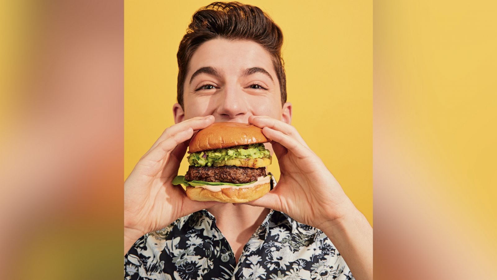 Eitan Bernath eats a Guac Burger.