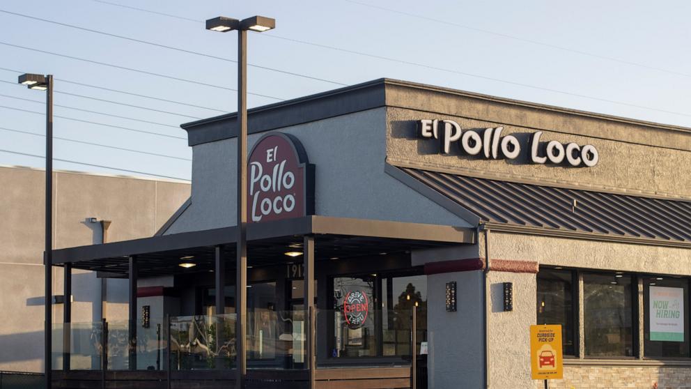 PHOTO: Exterior view of an El Pollo Loco restaurant in Huntington Beach, Calif., at dusk, on May 8, 2022.