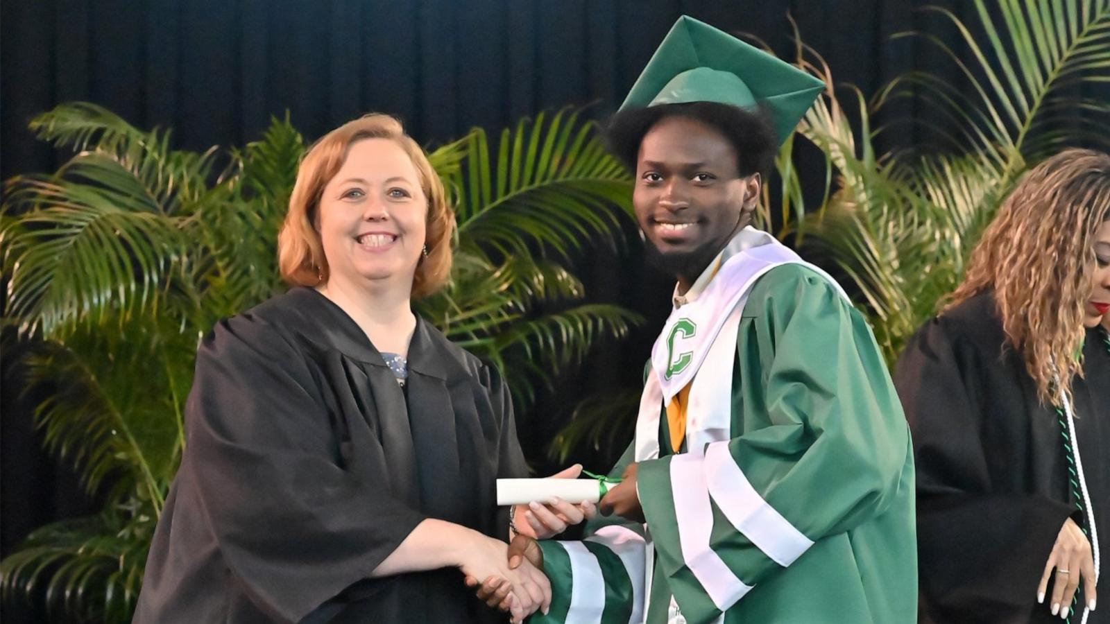 PHOTO: Elijah Hogan graduated from Walter L. Cohen High School as valedictorian. Hogan is pictured with Cohen High School Principal Rhonda Dale.