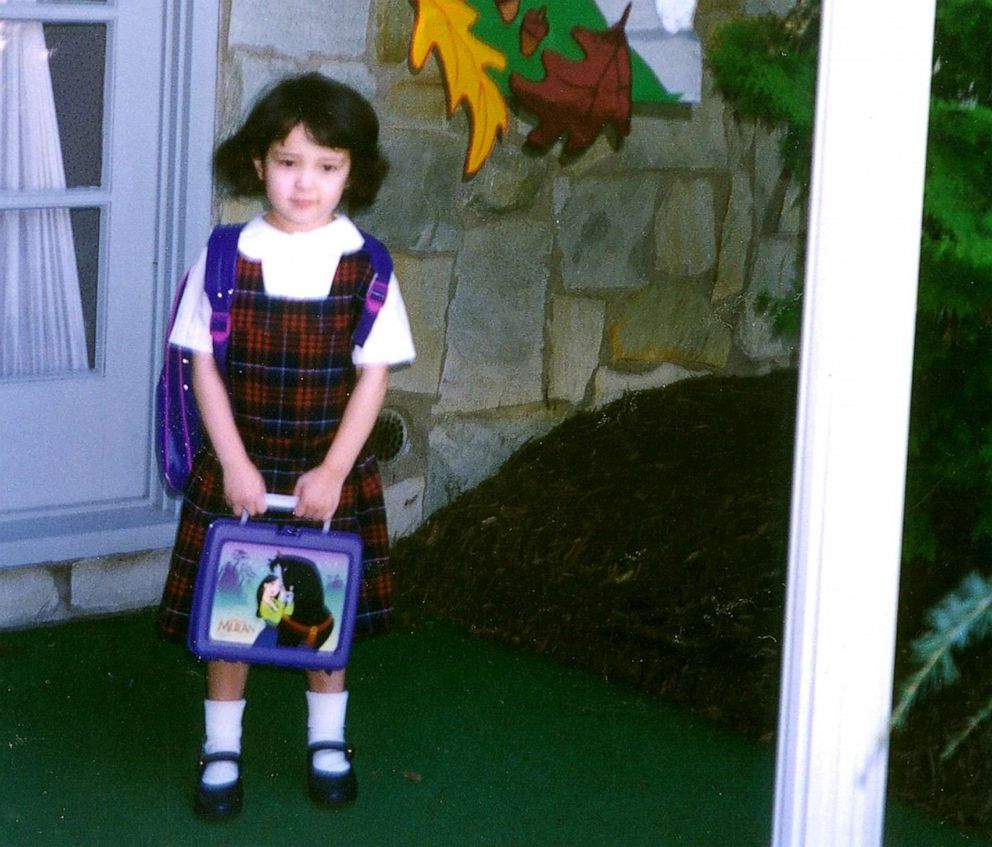 PHOTO: Standing in front of my house before heading off to Kindergarten with my "Mulan" lunchbox. 
