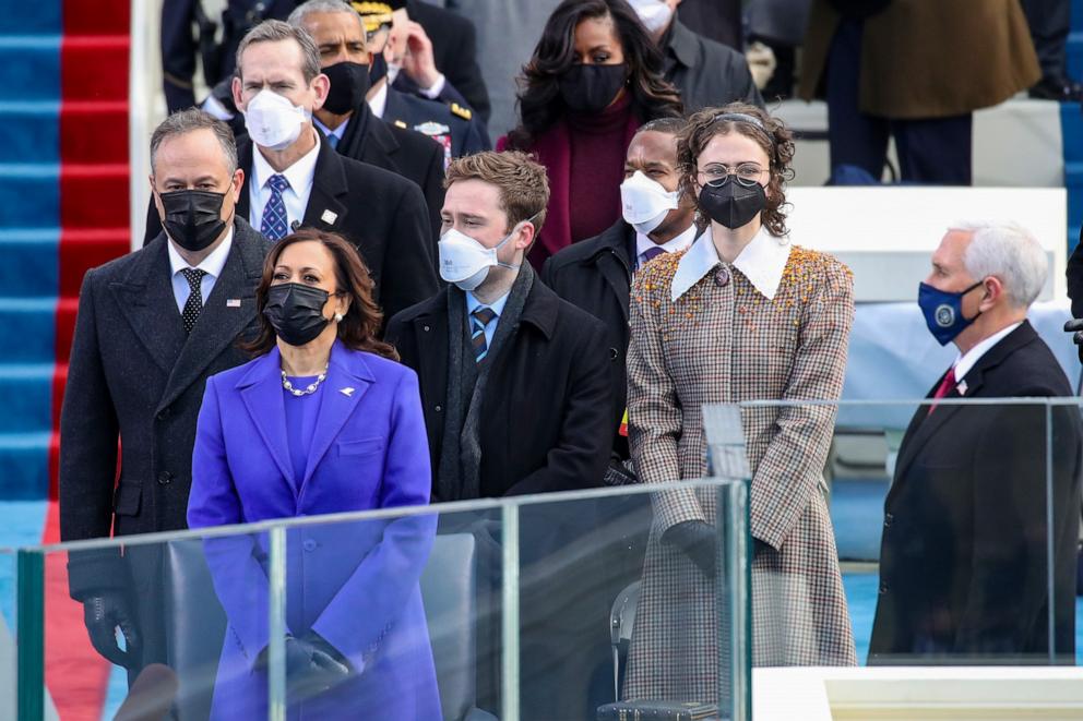 PHOTO: Doug Emhoff, Vice President Elect Kamala Harris, Cole Emhoff, Ella Emhoff, and Vice President Pence stand as Lady Gaga sings the National Anthem at the inauguration of U.S. President-elect Joe Biden in the Capitol on Jan. 20, 2021 in Washington.